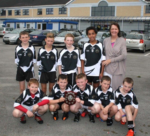 Winners of the Desmond College Hurling Blitz - Courtney Boys School with their Principal Mrs Rena Culhane