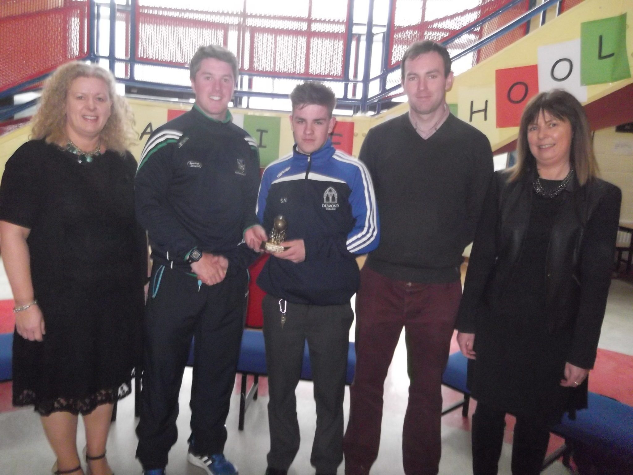 Shane Normoyle being present with his trophie by Eoin Ryan. Also in the photo Ms Gavin Barry, Mr Burke and Ms Cregan.