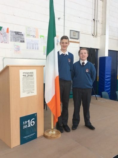 2016 March: Declan Kennedy and Cromac Browne picture after raising the flag at the 1916 commemoration ceremony in Desmond College