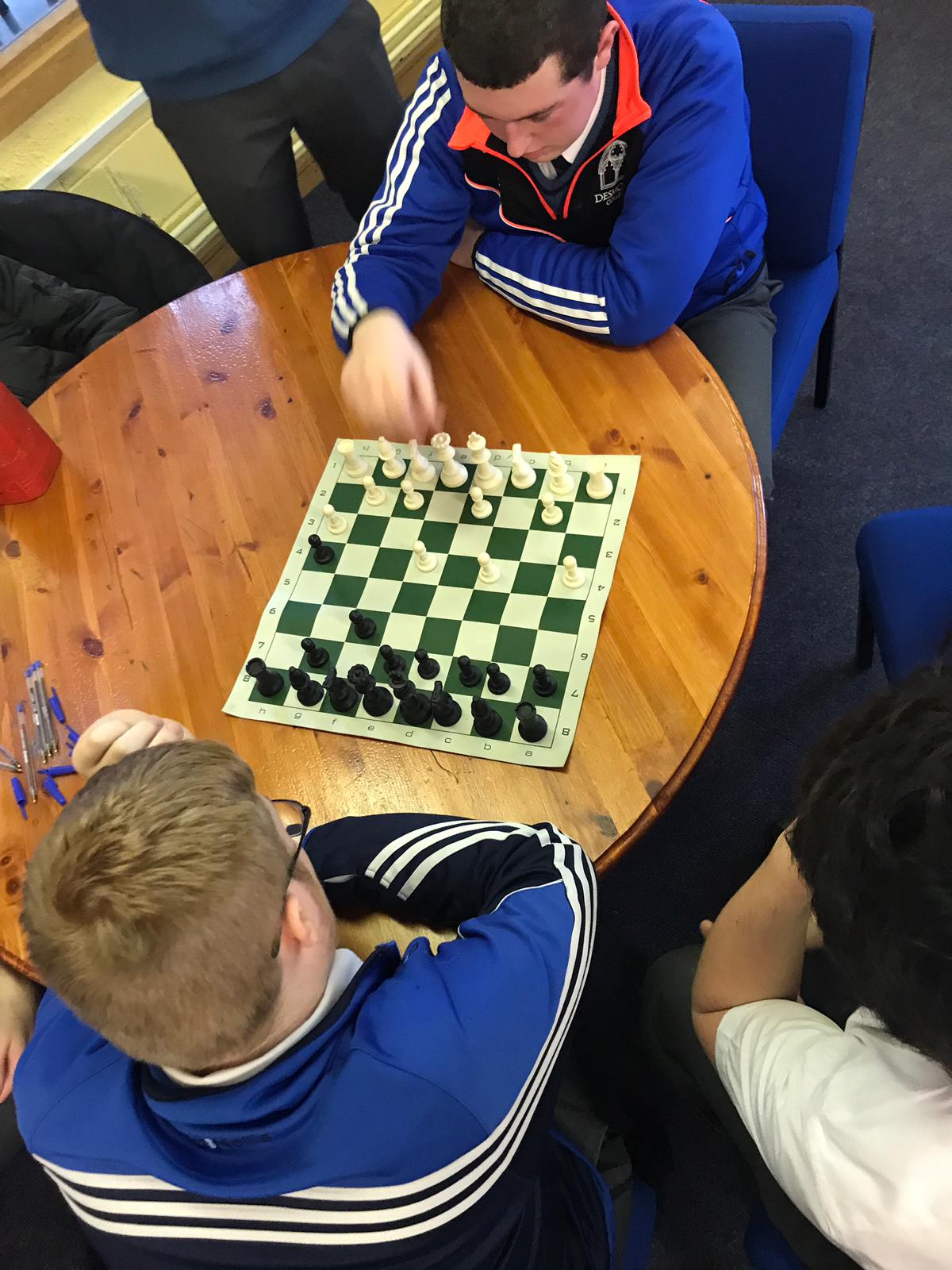 Evan Condon and AJ Dee enjoying a chess game at lunchtime