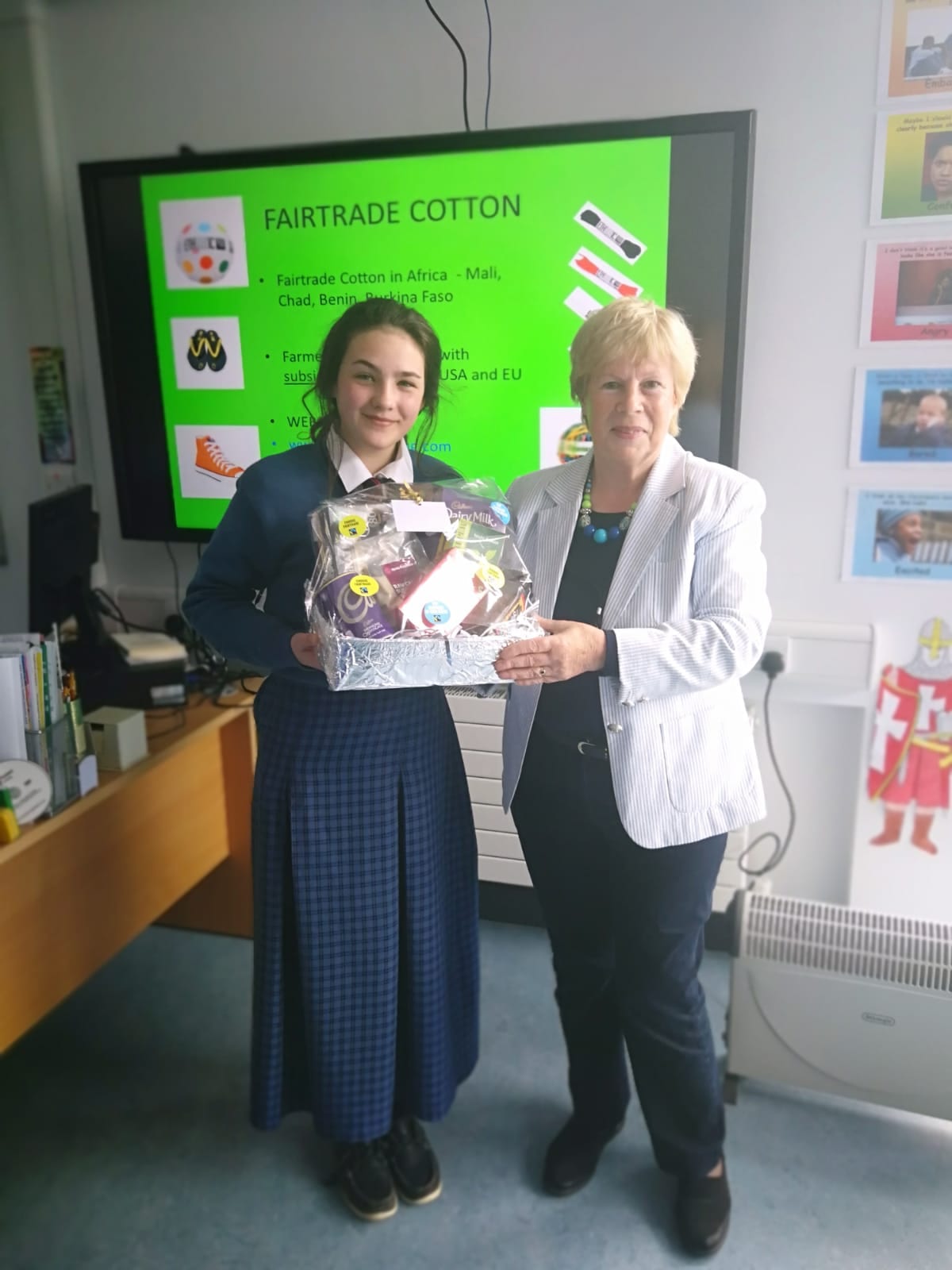 Edel McMahon receiving her hamper from Dolores O'Meara, Chairperson of Limerick Fairtrade