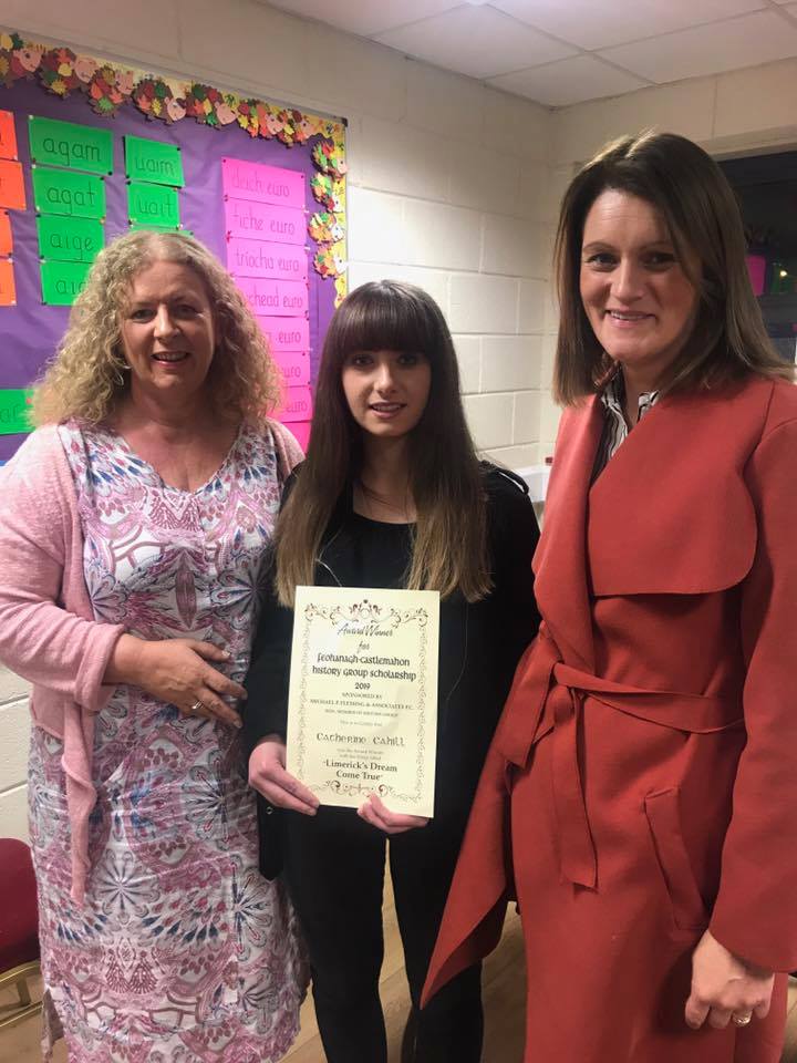 Vourneen Gavin Barry and Yvonne Condron pictured in school room on either side of Catherine Cahill, who is the winner of the Feohanagh-Castlemahon History Group Scholarship 2019